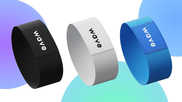Three NFC bracelets in black, white, and blue.